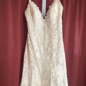 Never worn Wedding dress size 16. No alterations sand ivory and silver.